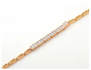 Detailed macro view of 18K gold plated bracelet with square zircon and Greek key pattern