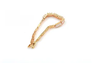 Detailed shot of 18K gold plated chain bracelet with rectangular zircon stones in claw setting