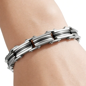 Close-up of industrial silver and black layered stainless steel chain bracelet for men