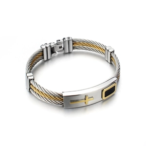 Detailed close-up of men's stainless steel cable bracelet with gold cross and fold-over clasp