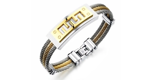 Detailed close-up of a dual-tone twisted cable men's bracelet with Greek key pattern