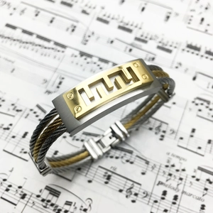 Men's titanium steel bracelet with gold Greek key pattern and twisted cable wire band