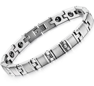 Detail of stainless steel magnetic therapy bracelet with inset black health magnets