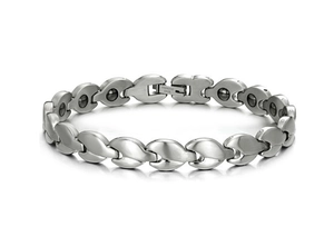 Detail view of silver stainless steel magnetic bracelet with water drop links and folding clasp