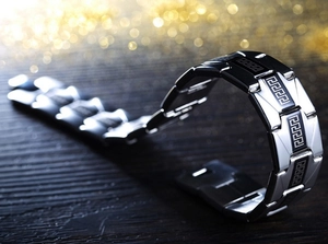 Men's wide stainless steel chain bracelet with silver Greek meander patterns on black links