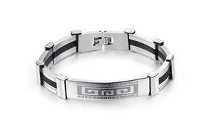 Macro detail of men's titanium steel bracelet with Greek key pattern and black silicone