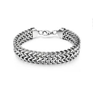 Detail of masculine square scale pattern woven link chain bracelet in polished steel