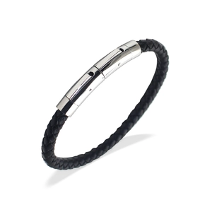 Close-up of black braided leather bracelet for men with polished silver buckle
