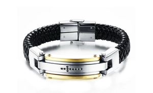 Detail of woven black leather bracelet with cross pendant and metal clasp