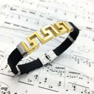 Men's titanium steel and black silicone bracelet featuring a gold Greek key pattern