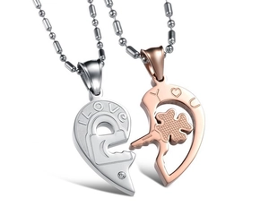 Detailed macro view of silver and rose gold heart pendant necklace for couples with engraving