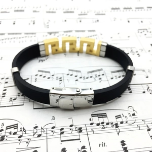 Men's titanium steel and black silicone bracelet with golden Greek key pattern