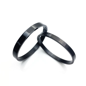 Polished black titanium steel couple bracelets with minimalist mirror finish for men and women