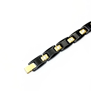 Bracelet pour homme en acier inoxydable doré avec céramique noire et zircons cubiques