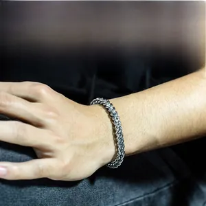 Close-up of men's titanium steel wheat chain bracelet worn on a wrist for a modern look