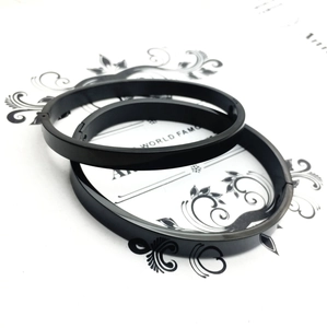 Minimalist black titanium steel bangle set for couples with a sleek matte finish