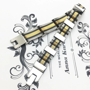 Men's two-tone stainless steel and black silicone bracelet with industrial grooved links