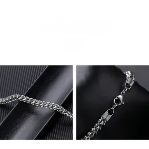 Detail of the high-polished wheat chain link and lobster clasp on this men's steel bracelet