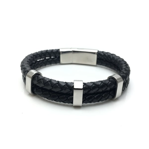 Detail of double-layer black braided leather bracelet with stainless steel magnetic clasp