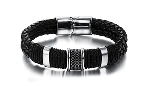 Men's braided black leather bracelet featuring silver magnetic clasp and textured metal charms