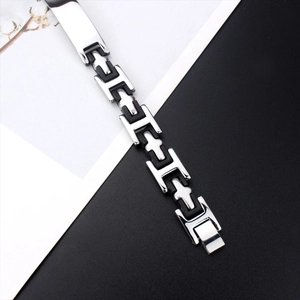 Close-up of industrial H-link silicone and steel bracelet with fold-over clasp