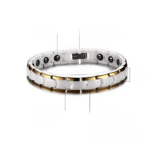 Detail showing white ceramic and gold-plated steel link bracelet with black hematite stones