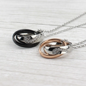 Romantic titanium steel couple necklaces with interlocking double rings and zircon accents