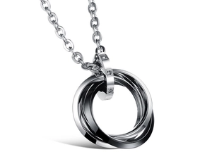 Detail of interlocking silver and black rings pendant with three inlaid rhinestones