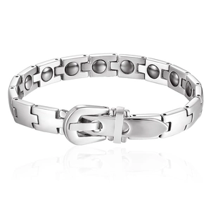 Macro detail of silver magnetic therapy bracelet featuring H-shaped links and buckle clasp