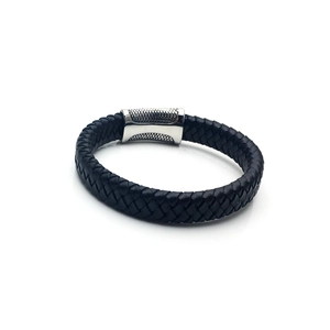 Detail of black braided leather bracelet with silver stainless steel magnetic clasp