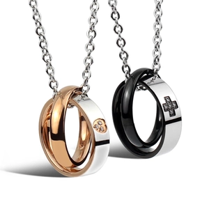 Detail of interlocking circle necklaces with cross and heart crystal embellishments
