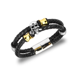 Macro shot of silver skull with rose detail on double-layered black woven leather bracelet