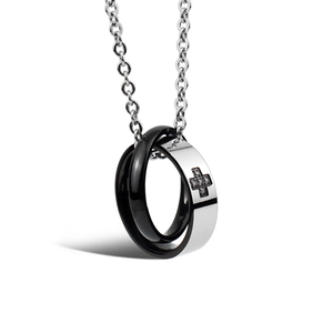 Polished black and silver interlocking ring pendant necklace with crystal cross