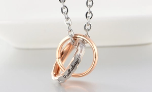 Interlocking double ring necklace in silver and rose gold with romantic engraving