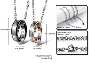 Detail of interlocking titanium steel couple necklaces with Love Eternal engravings and zircons