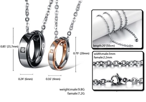 Detail view of interlocking titanium couple rings with crystal inlay and lobster clasp