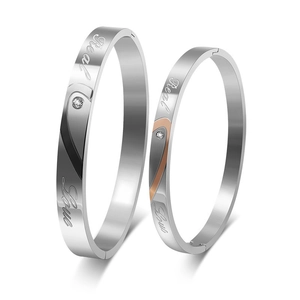 Detail of Real Love engraved couple bracelets with crystal and rose gold inlay