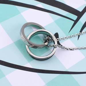 Close-up of interlocking double ring pendant with LOVE and Forever engraved lettering