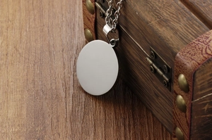 Polished silver stainless steel round pendant on chain with vintage wooden gift box