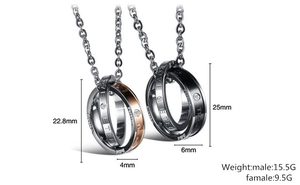 Detailed view of titanium steel interlocking rings with rhinestone inlay and size labels