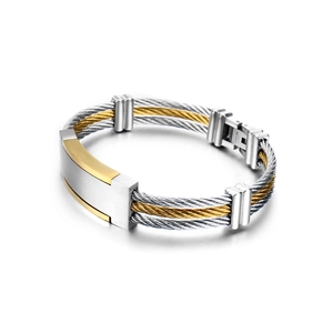 Two-tone stainless steel cable bracelet with gold accents and a rectangular plate