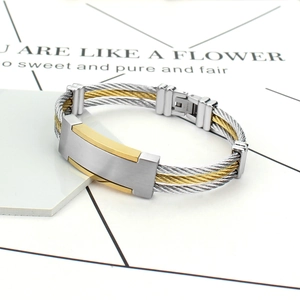 Two-tone steel cable woven bracelet with rectangular gold-plated plate and secure flip clasp