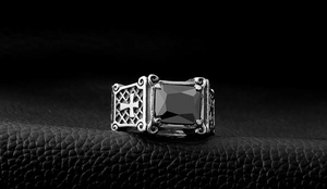Detailed close-up of retro gothic titanium steel ring featuring a large black gemstone