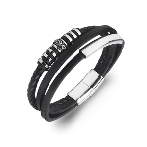 Close-up of triple-layer leather bracelet with vintage scroll bead and magnetic clasp