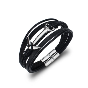 Detailed shot of multi-layer braided leather bracelet with silver anchor and magnetic clasp