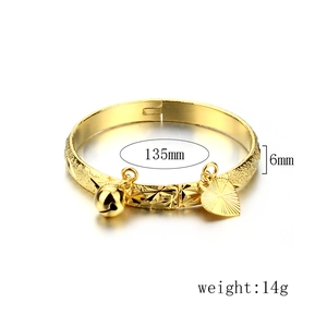 Polished 18K gold plated kids bangle with bell, heart charm, and 135mm circumference