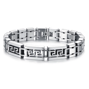 Macro detail of men's titanium steel link bracelet with engraved Greek Meander pattern