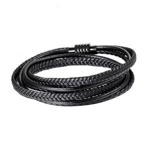Detail of multi-layer braided leather bracelet with black magnetic clasp texture