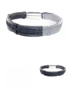 Detail of men's black braided leather bracelet featuring a silver magnetic metal clasp