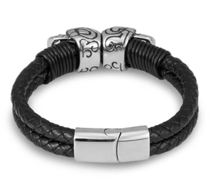 Detail of woven black leather bracelet featuring engraved metal beads and magnetic clasp